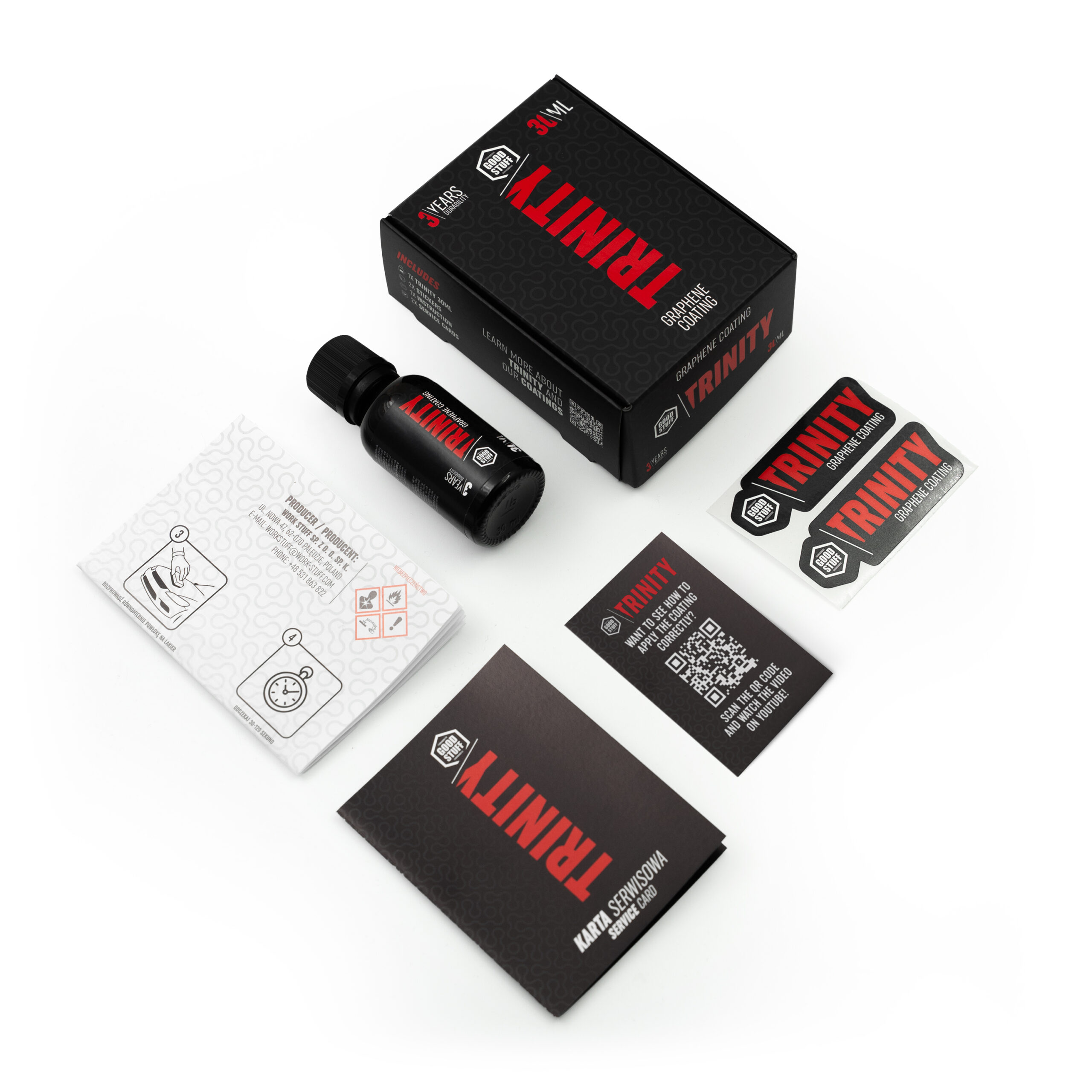 Top-down view of a TRINITY branded product kit, including a black bottle, a black box, two instruction booklets, a warranty card, and two rectangular TRINITY stickers, all arranged neatly on a white surface.