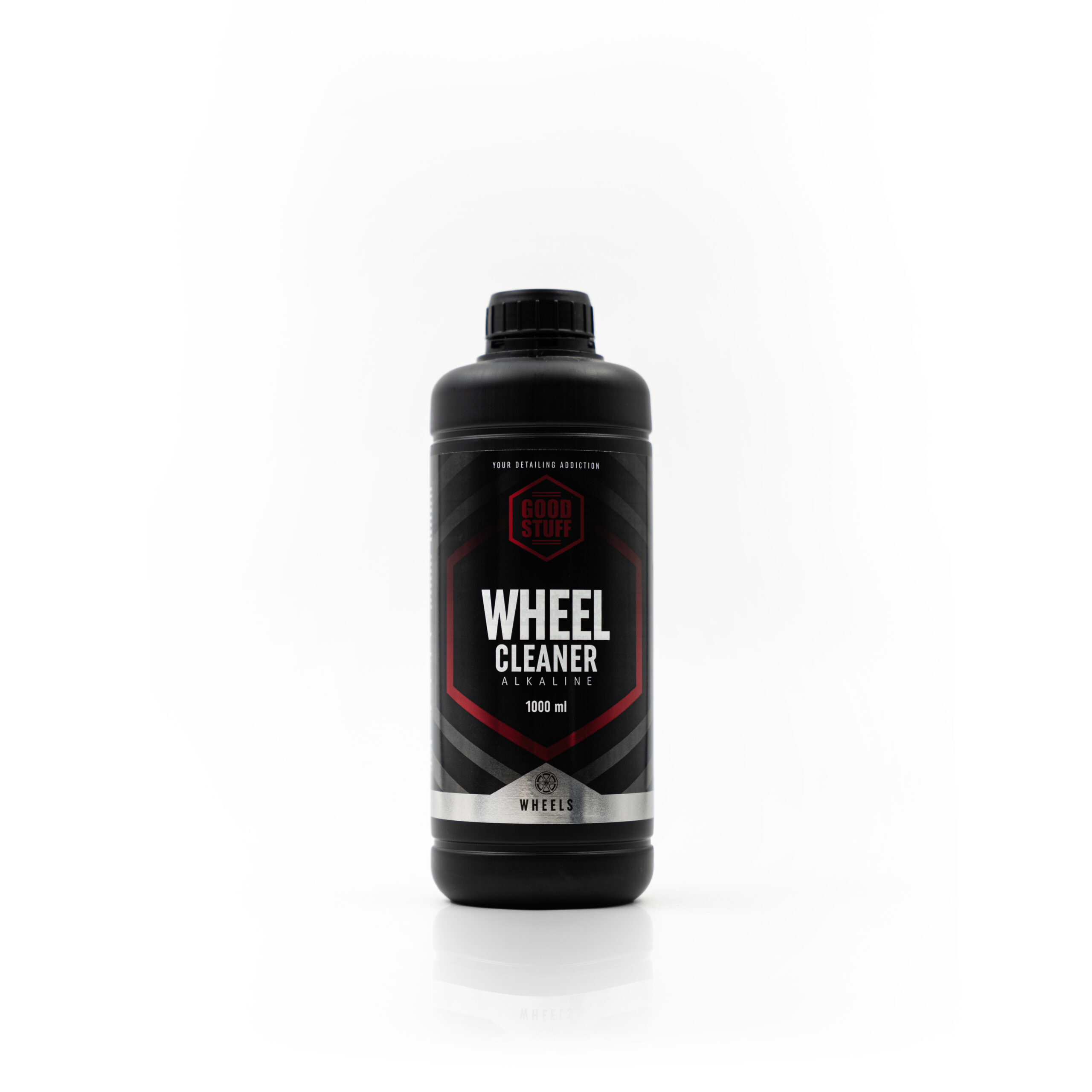 A black bottle of Good Stuff Alkaline Wheel Cleaner, 1000 ml, with a black cap and bold red, white, and gray label accents, stands upright on a white background—perfect as a powerful tire cleaner.